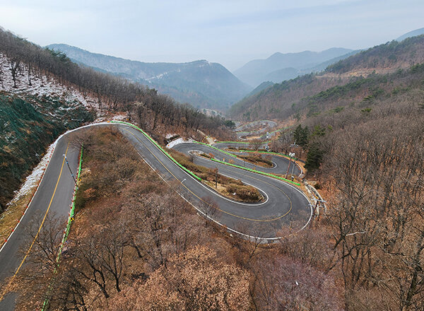 A mountain road switching back on itself